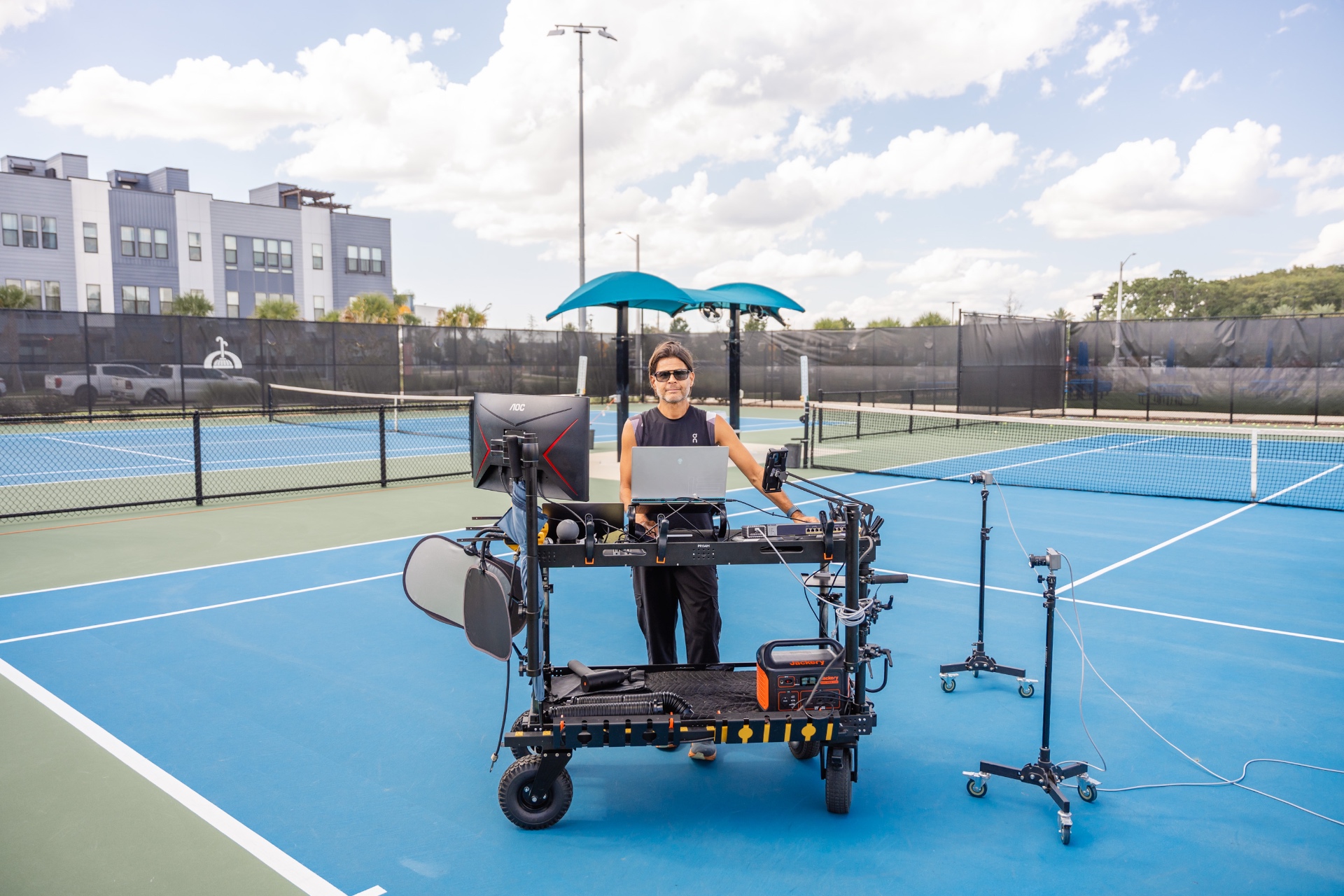 Coach Paul Lefiti with mobile motion capture rig on court